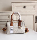 MICHAEL KORS HAYES SMALL DUFFLE BAG IN MK LOGO