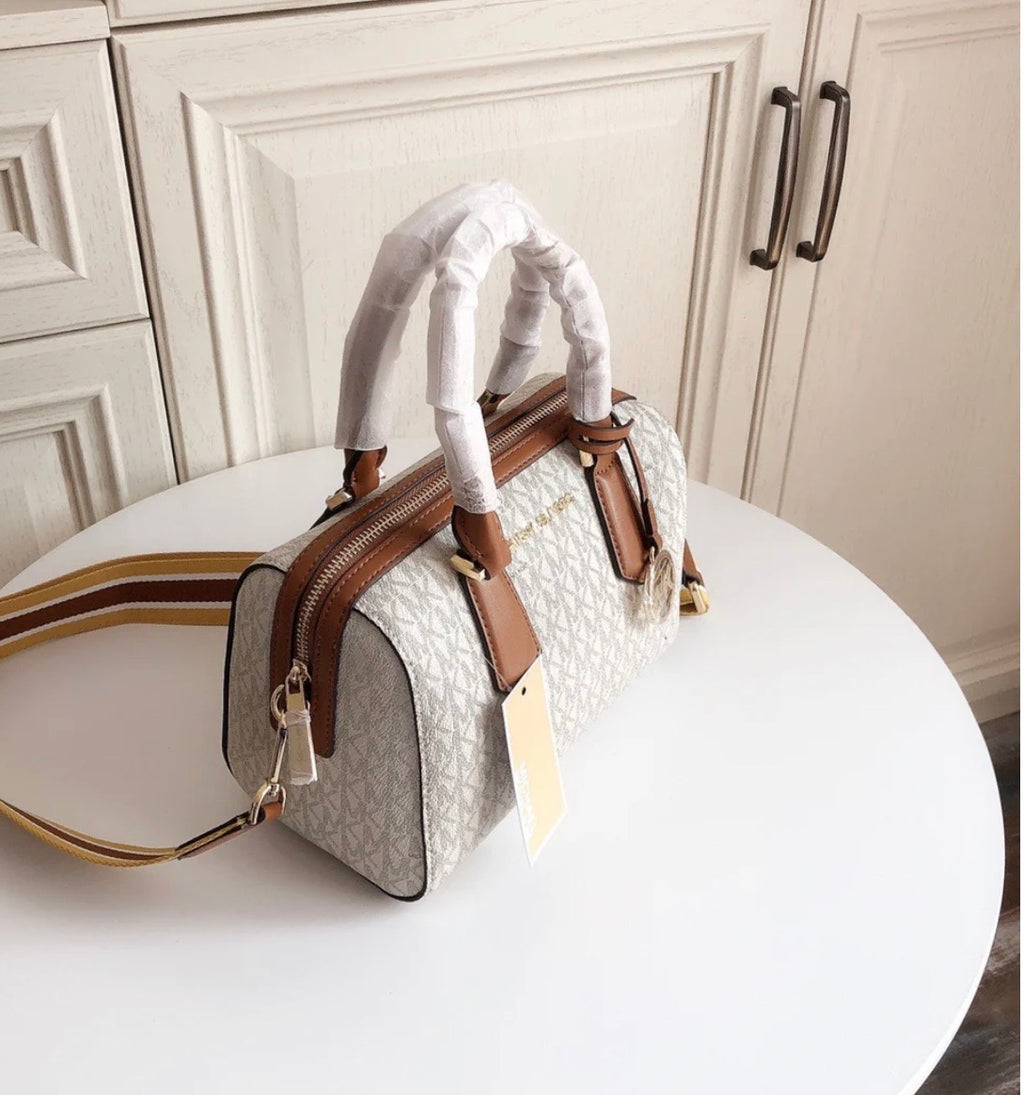 MICHAEL KORS HAYES SMALL DUFFLE BAG IN MK LOGO